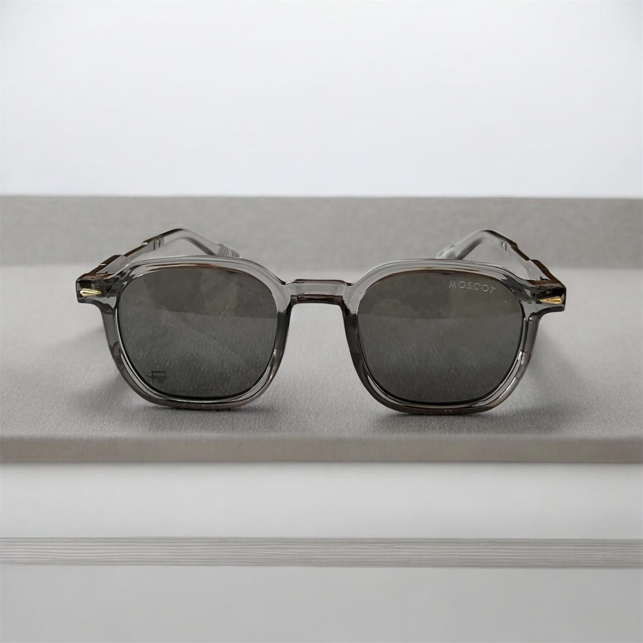 Lunettes de Soleil Moscot – Monture Transparente Grise